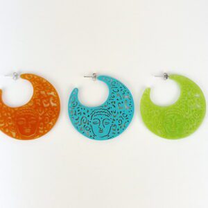 Three large, circular Buddha Resin Earrings with faces and patterns displayed side by side, in orange, blue, and green colors against a white background.