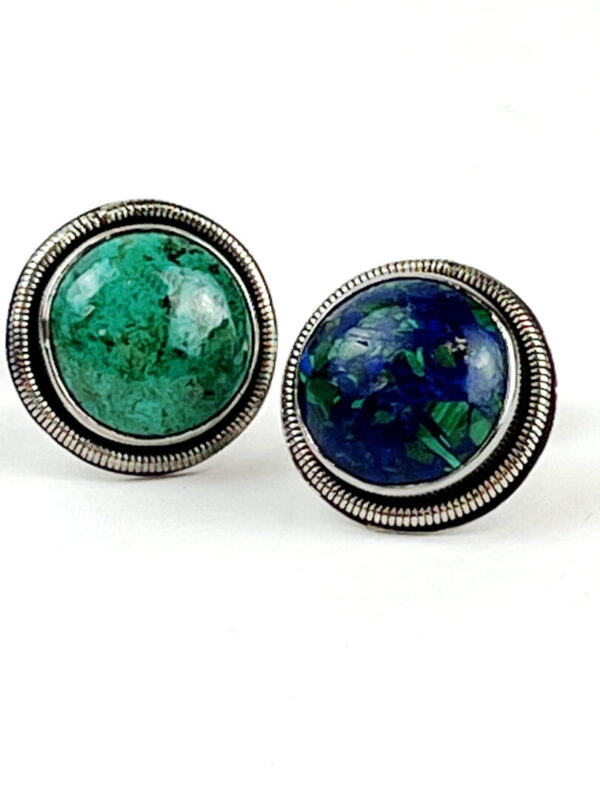 A pair of earrings with different colored stones.