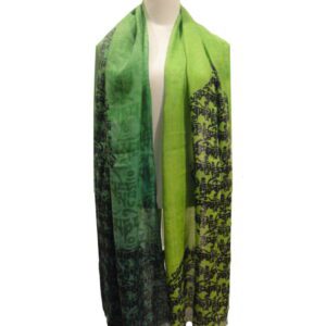 A green scarf with black and white elephants