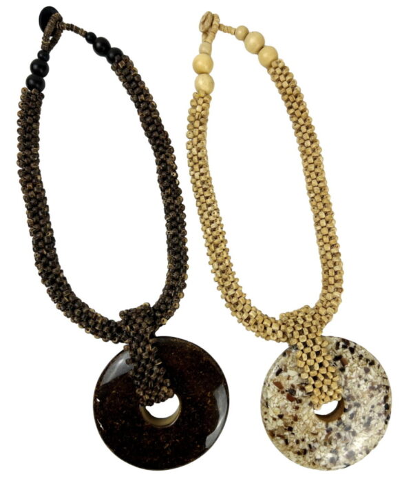 Two necklaces with a large round pendant on them.