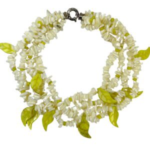 A necklace of white and green beads with leaves.