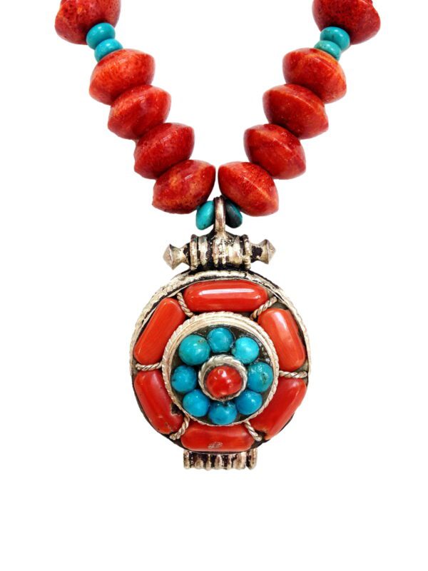 A necklace with red and turquoise beads on it.