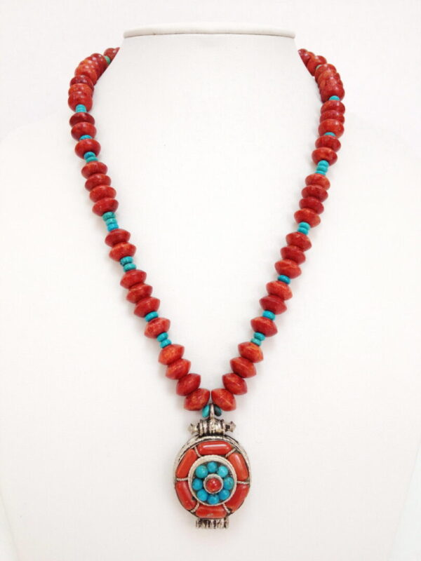 A necklace with red and blue beads on it
