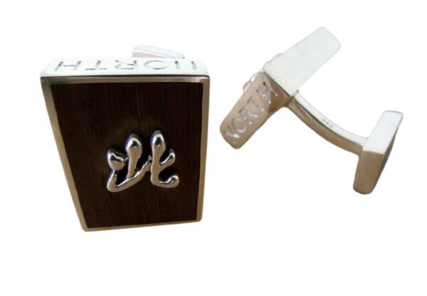 A pair of white metal handles with an el paso logo.