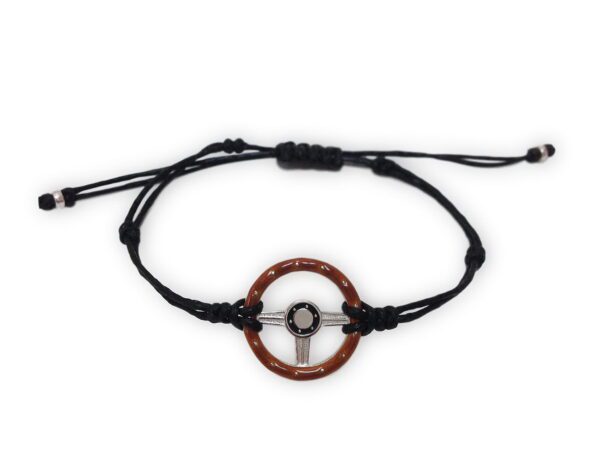 A bracelet with a steering wheel on it.