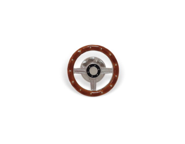A steering wheel with brown leather and chrome trim.
