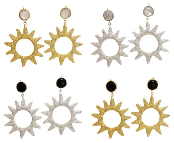 A set of four pairs of earrings with sun designs.