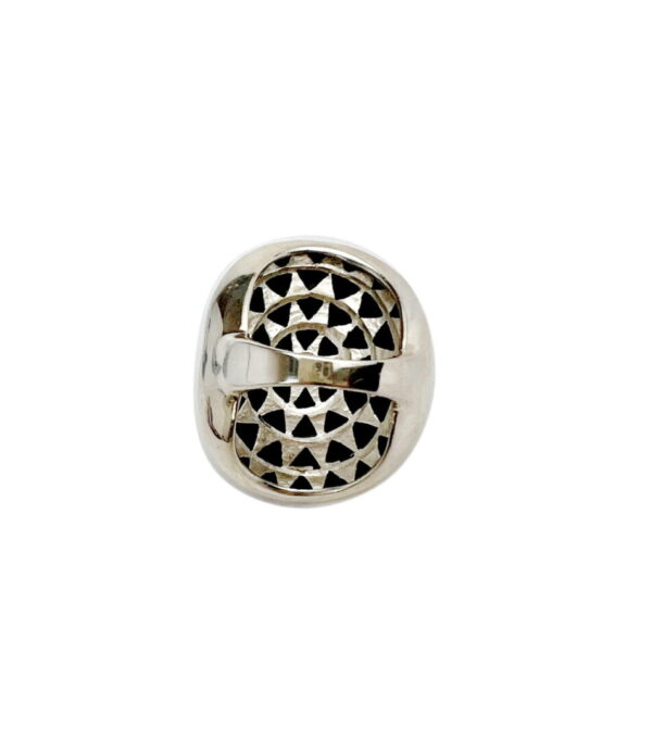 A silver bead with a pattern on it.