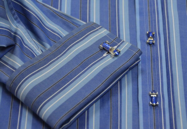 A blue striped fabric with cars on it
