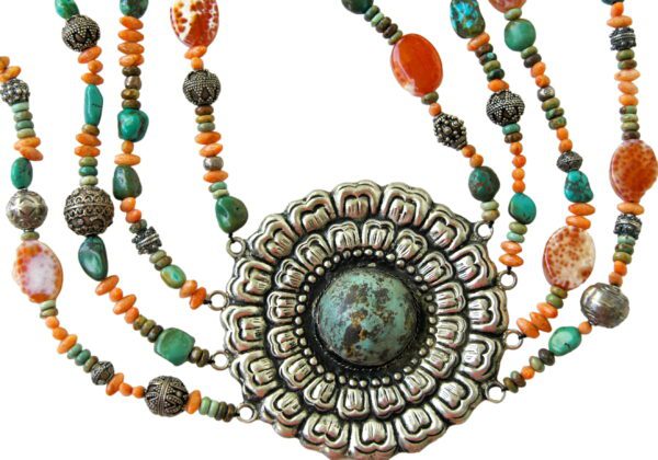 A necklace with multiple strands of beads and an ornate medallion.