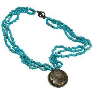 A necklace with turquoise beads and an oriental coin.