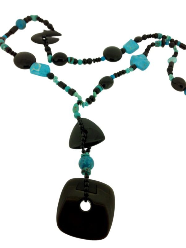 A necklace with black and blue beads on it.