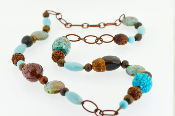 A close up of a necklace with beads