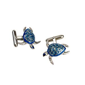 A pair of turtle cufflinks with blue and green enamel.