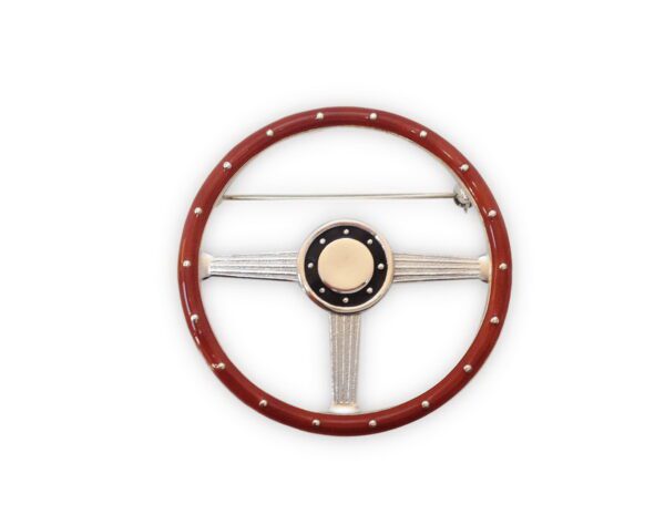 A steering wheel with the center ring in red.