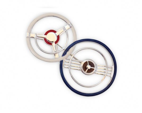 Two Double Steering Wheel Brooch with circular designs, one silver and one navy blue, against a white background.