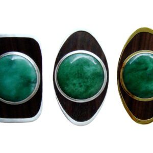 Three different colored rings with a green stone on them.