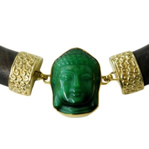 A close up of a necklace with a buddha head