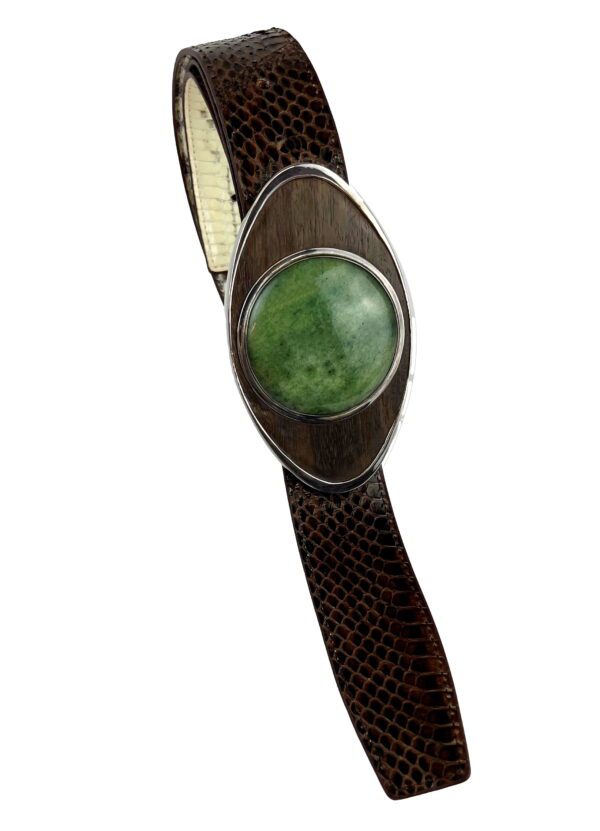 A green stone on a brown leather strap.