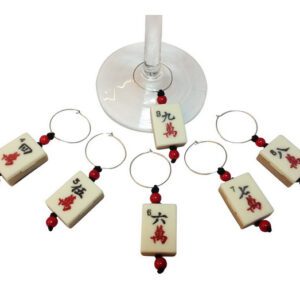 A set of six wine glass charms with a red and white design.
