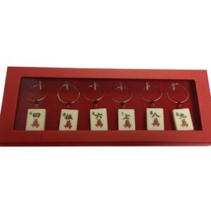 A red tray with a set of eight pairs of earrings.