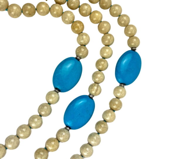 A close up of a necklace with beads