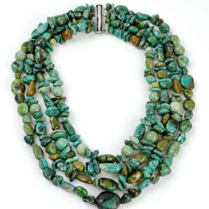 A necklace of turquoise beads and silver clasp.