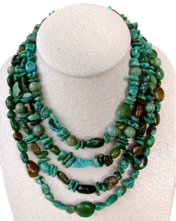 A necklace of turquoise and other stones on display.