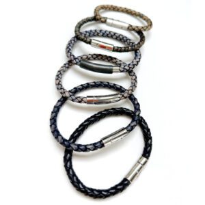 A row of six bracelets with different colors and sizes.