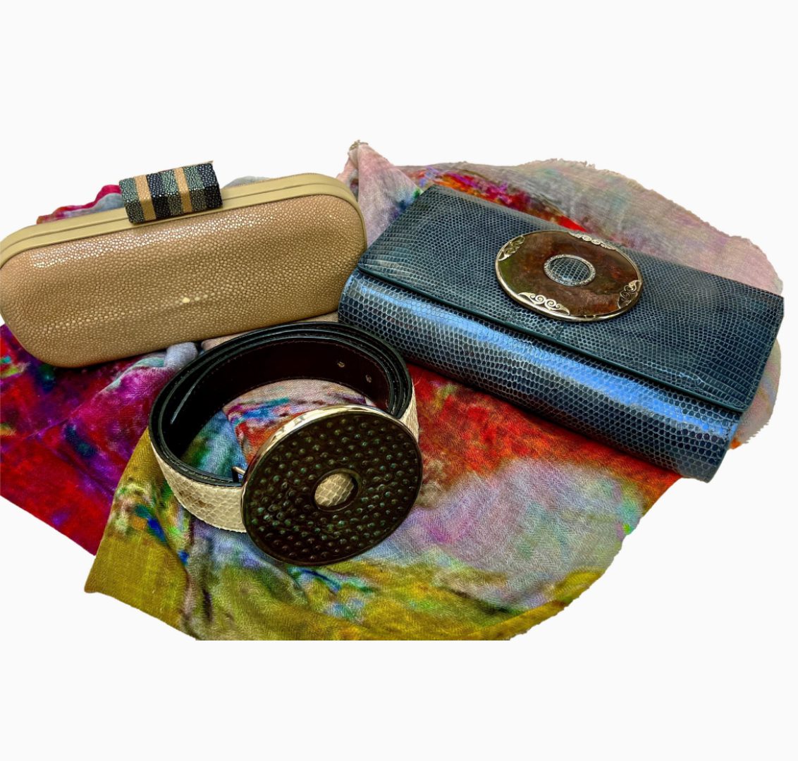 A group of three clutches sitting on top of a table.