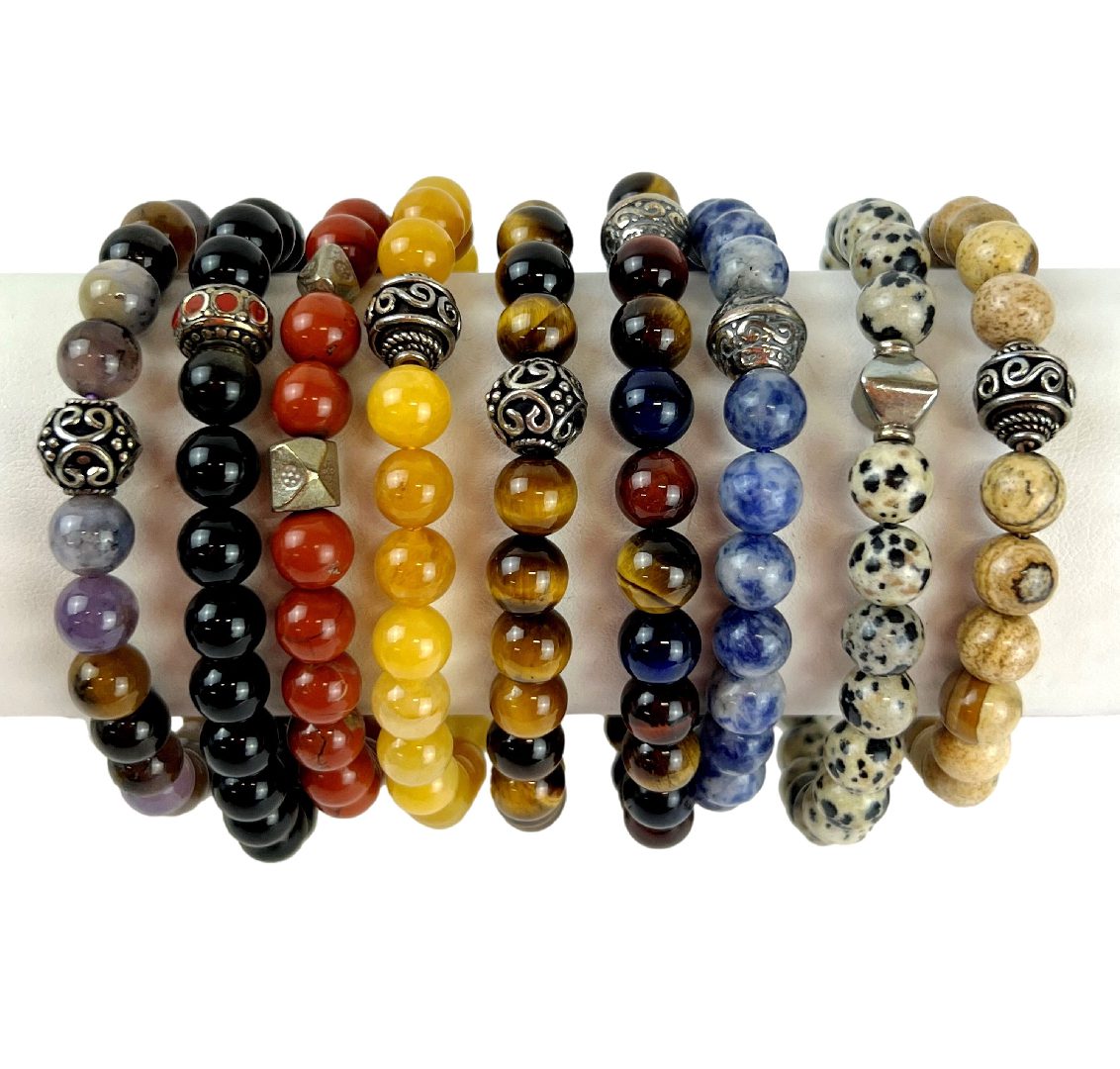 A group of bracelets that are all different colors.