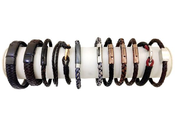 A white plastic holder holding many different bracelets.