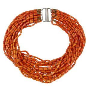 A necklace of orange beads with a silver clasp.