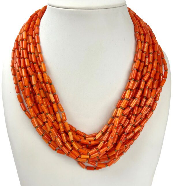 A necklace of orange beads is shown on a white background.