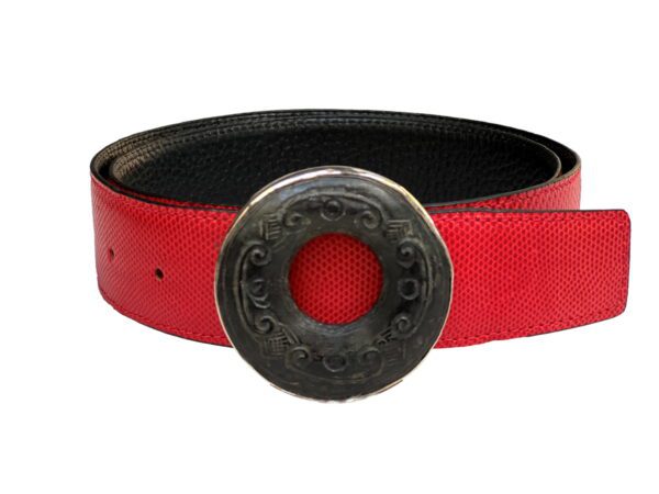 A red belt with a black circle on it