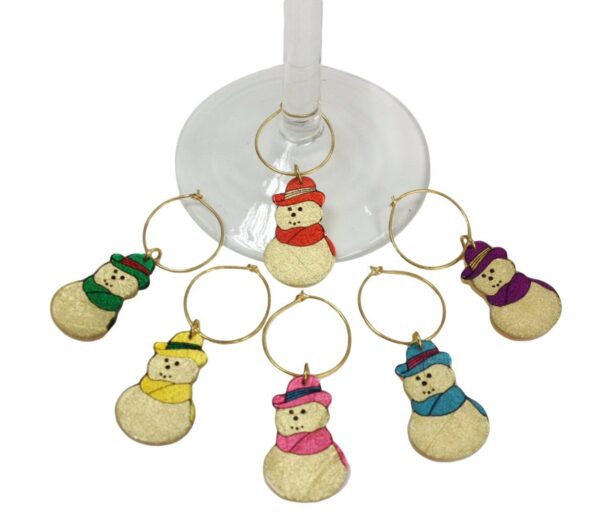 A set of six wine glass charms with bears in hats and scarfs.