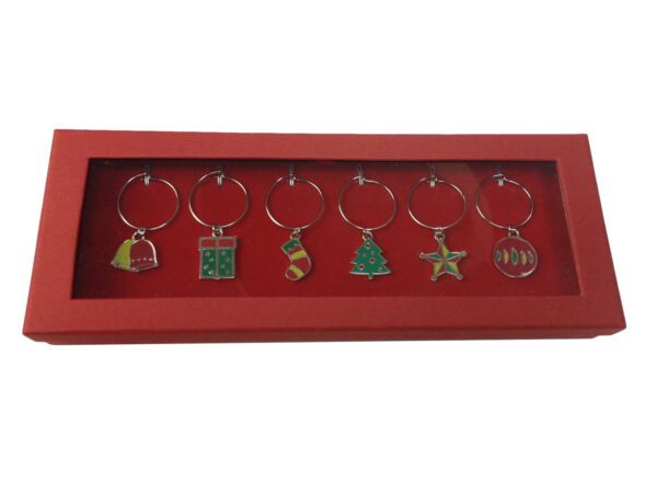 A red tray with six wine glass charms.