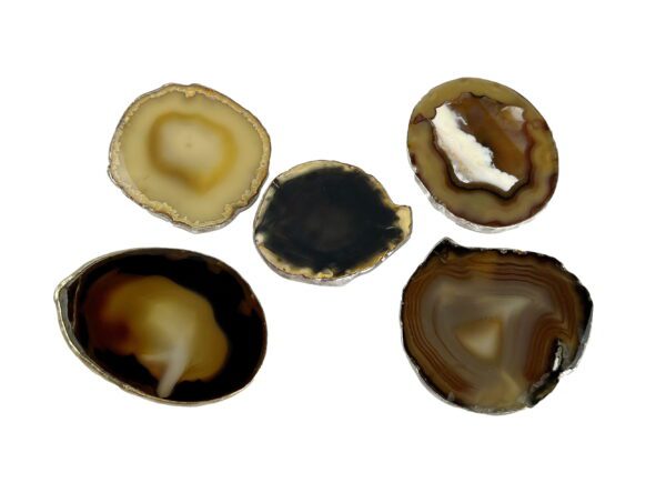 A group of five brown agate slices sitting on top of each other.