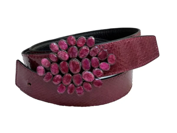 A purple belt with a flower on it.