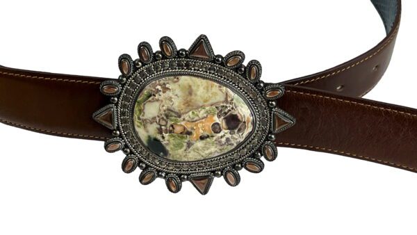 A belt with an oval picture of a man and woman.