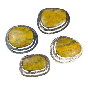 A set of four yellow stones sitting on top of each other.