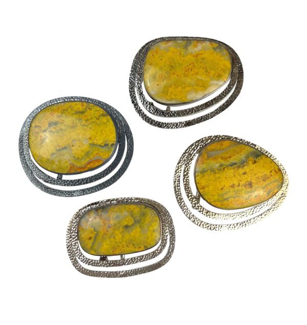 A set of four yellow stones sitting on top of each other.